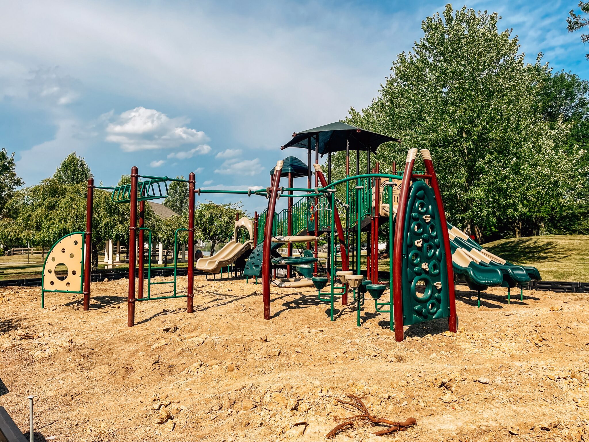 Shaded deck area at Coconut Grove Playground with seating at Shayler Crossing, Batavia, Ohio