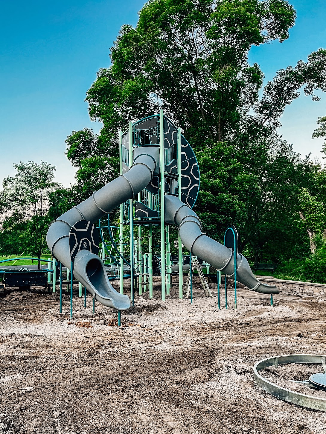 Tall tower with slides as part of commercial playground equipment in Bloomington, IN
