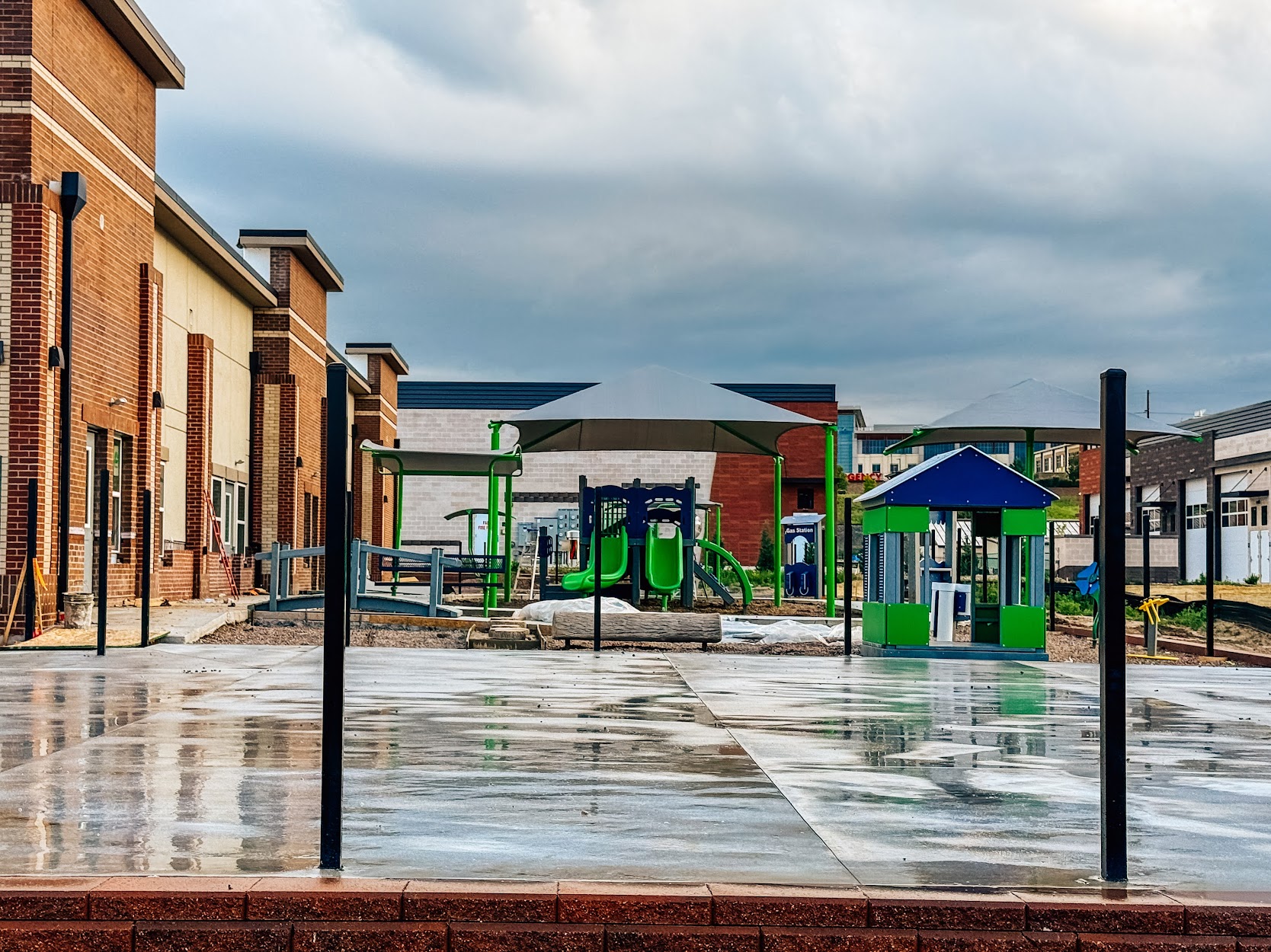 Second climbing play structure installed at Kiddie Academy in Castle Rock, featuring rock climber and slides.