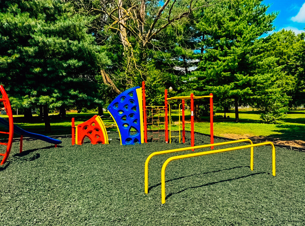 Close-up of a rock wall climbing structure in a commercial playground in Cairo, IL.